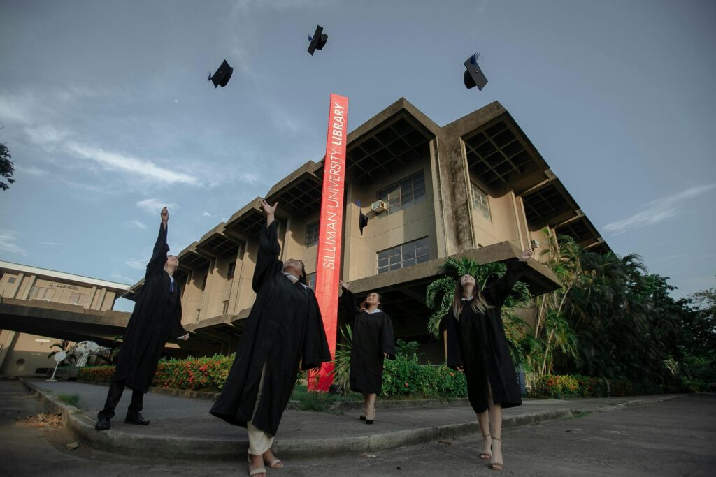 People Throwing Graduating Hats in the Air